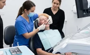 A dental patient having dentures fitted.